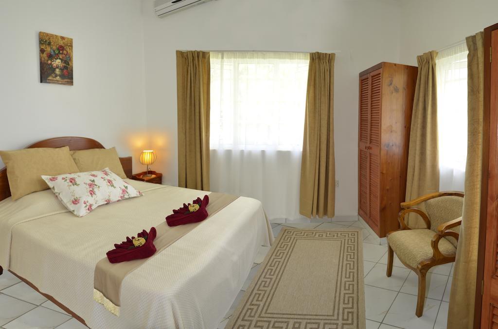 Ixora Villa Anse Royale Kamer foto
