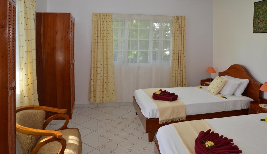 Ixora Villa Anse Royale Kamer foto